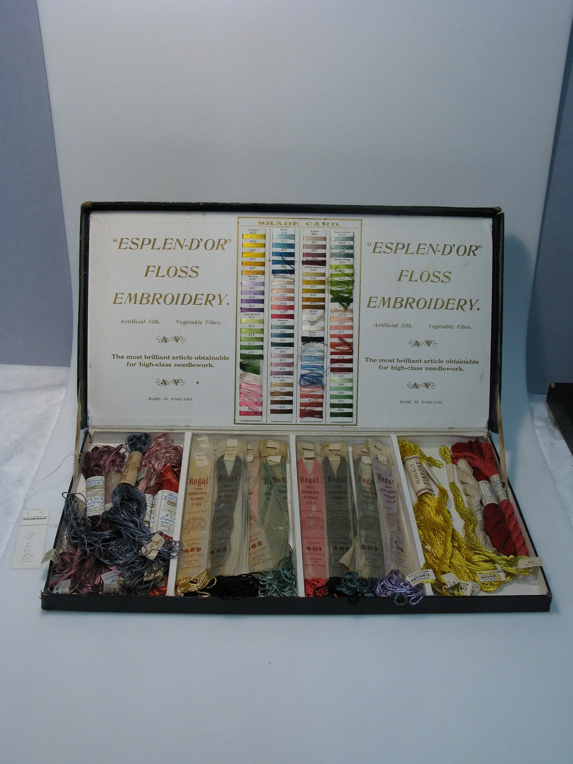 An open box of Esplen D'Or floss embroidery thread, with a colour card in the lid and skeins sorted in rows